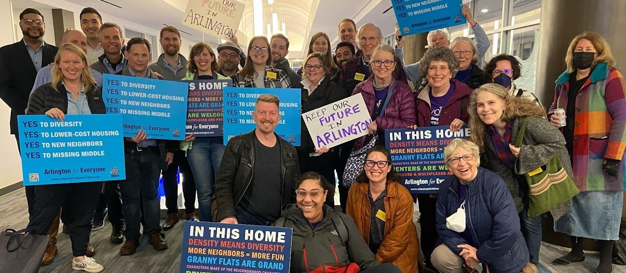 YIMBYs of NOVA volunteers holding signs